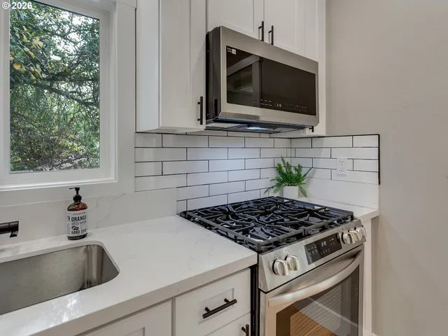 a kitchen with a stove and a sink