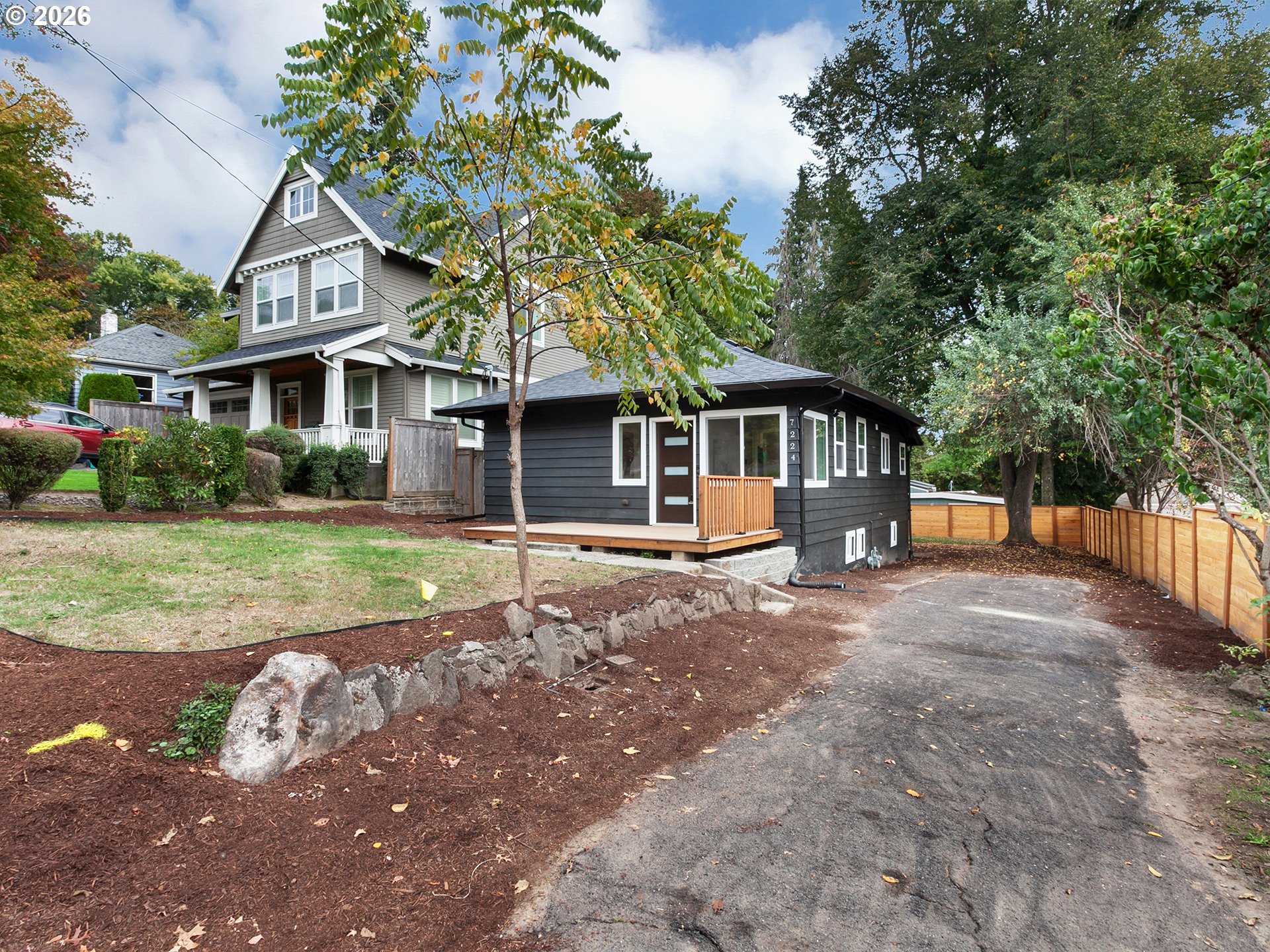 7224 Southwest 3rd Avenue Portland, OR 97219 - Photo 2 of 42 a front view of a house with a garden