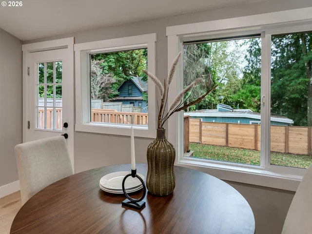 a workspace with hardwood floor and windows