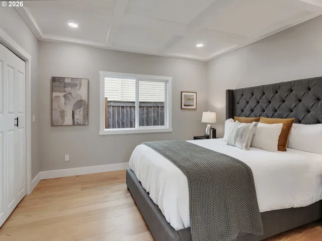 a bedroom with bed and window