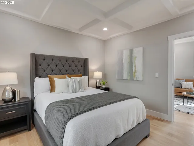 a bedroom with a bed and a lamp