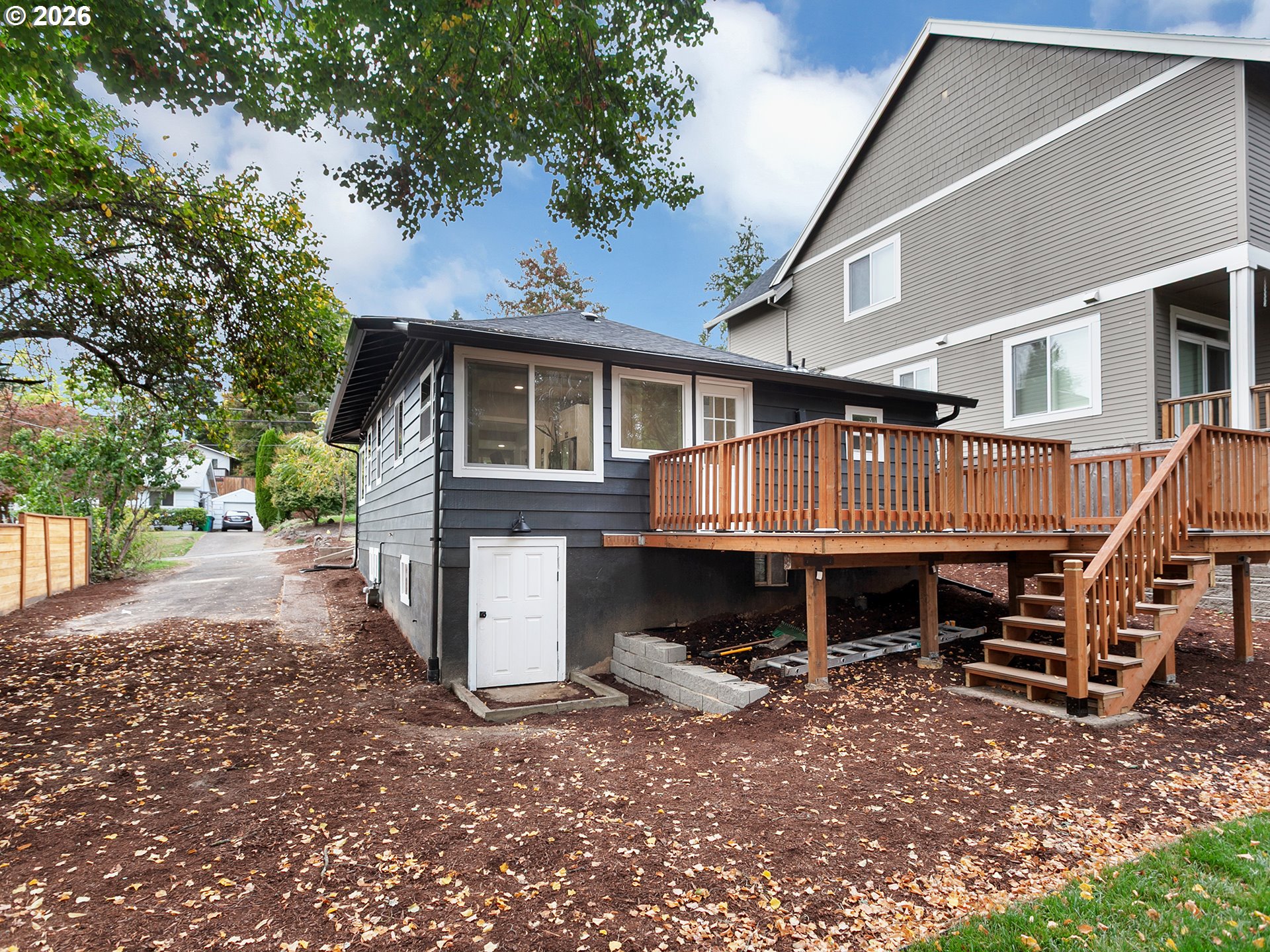 7224 Southwest 3rd Avenue Portland, OR 97219 - Photo 39 of 42 a view of house with a yard and wooden fence