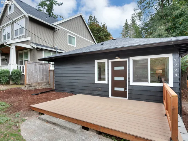 a front view of a house with large windows