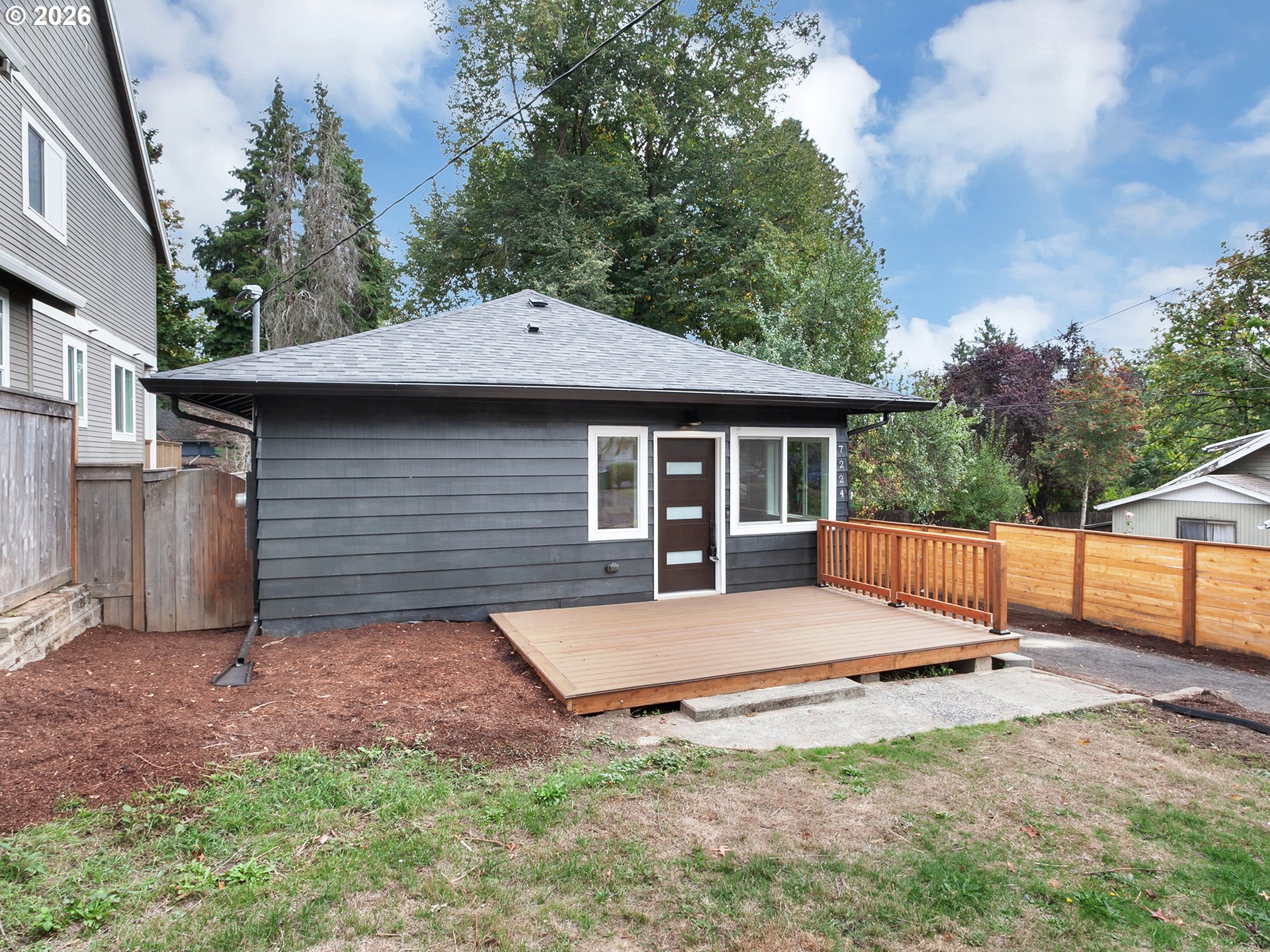 7224 Southwest 3rd Avenue Portland, OR 97219 - Photo 5 of 42 a view of a house with backyard and sitting area