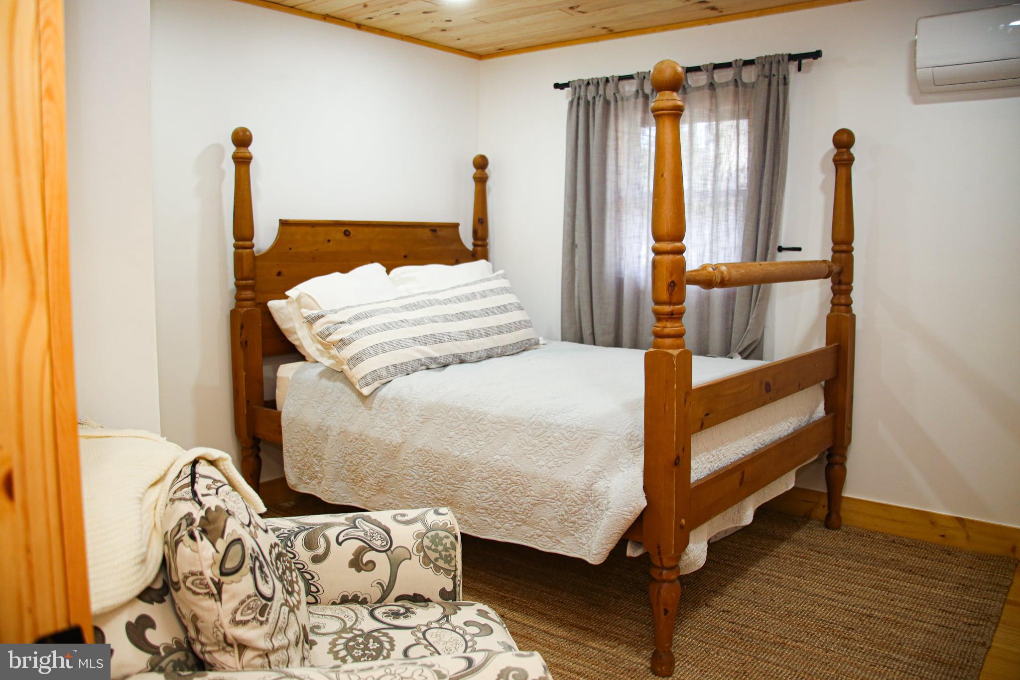 120 Rock Lodge Road McHenry, MD 21541 - Photo 9 of 23 a bedroom with a bed and a window