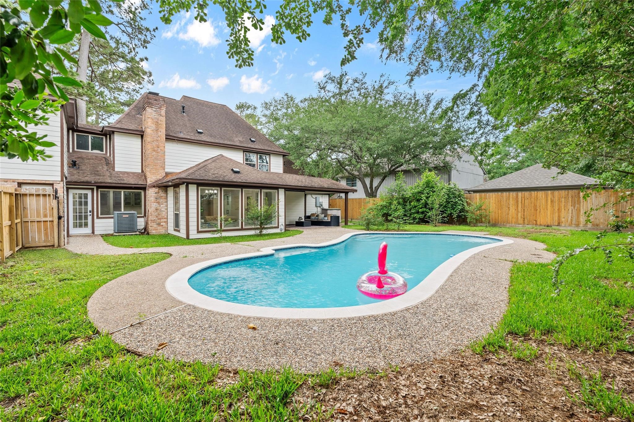 a aerial view of a house with swimming pool and porch