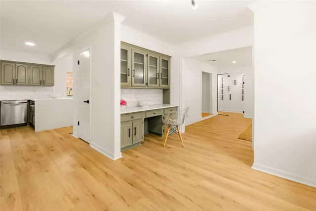 a view of kitchen with furniture and wooden floor
