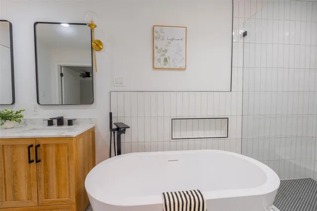 a bathroom with a bathtub and a sink
