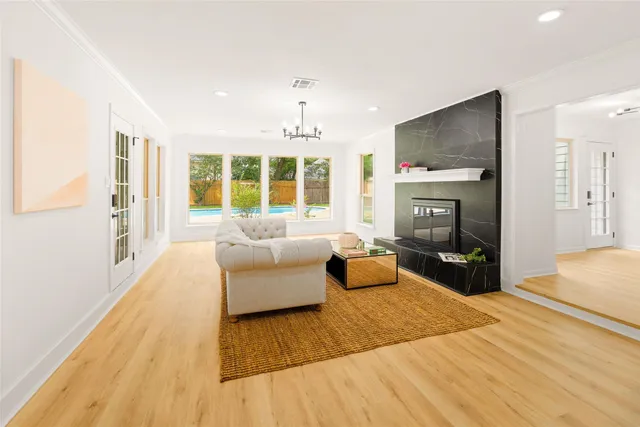 a bedroom with furniture and a fireplace