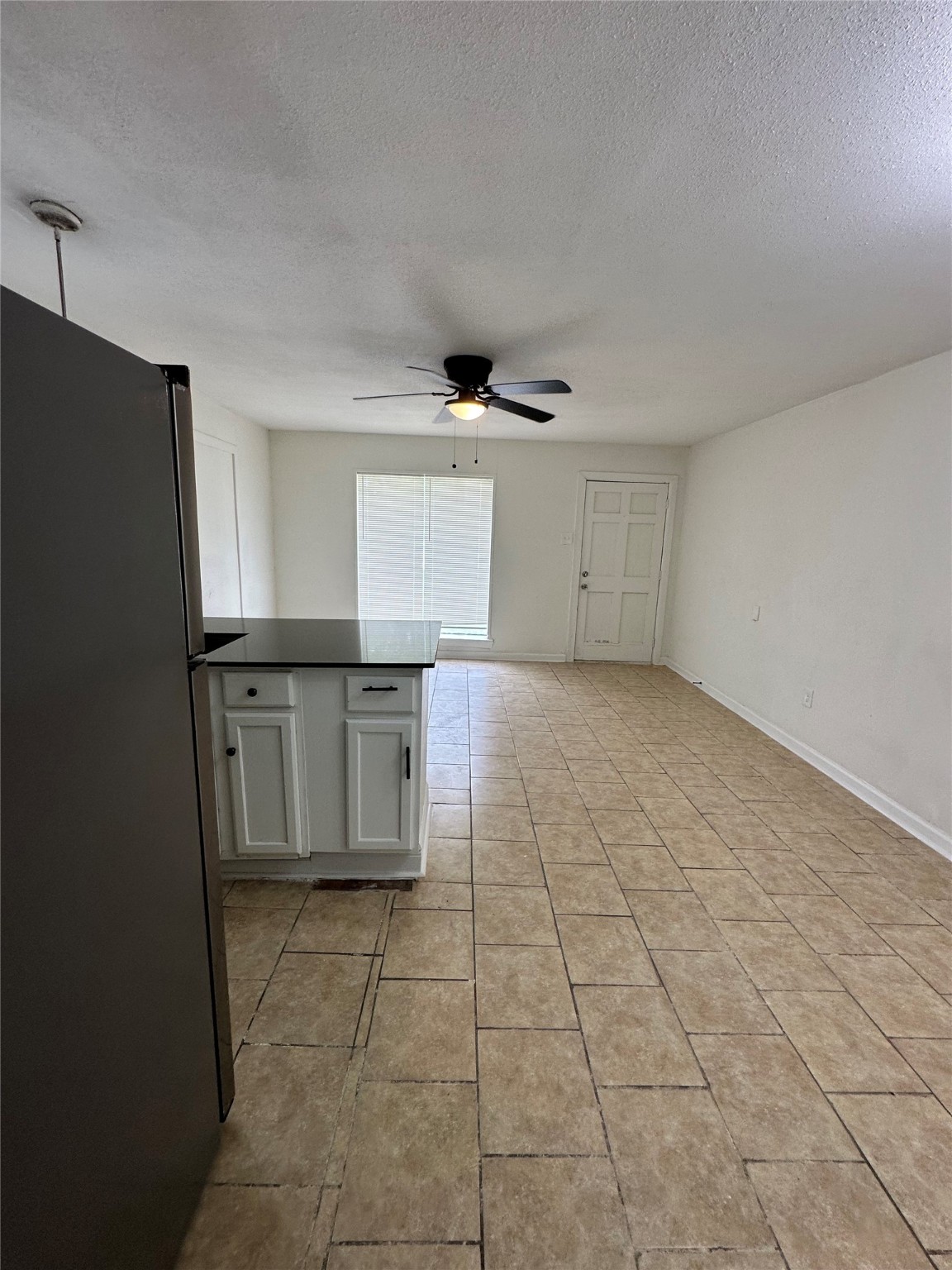 7610 Red Robin Lane, Unit 2 Houston, TX 77075 - Photo 11 of 16 a kitchen with granite countertop a stove a sink and a refrigerator