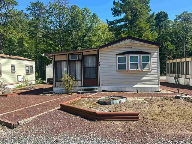 a front view of a house with yard