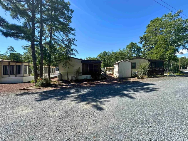 a view of a outdoor space with garden and tree
