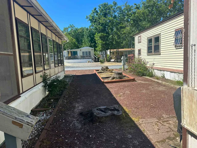 a view of backyard with patio