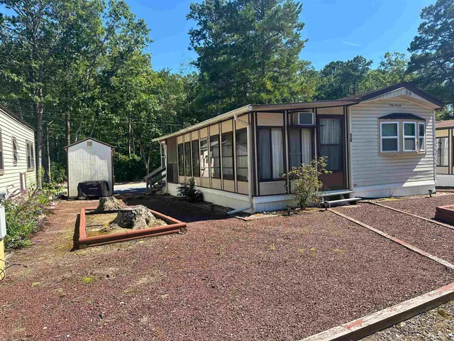 a view of backyard with a patio