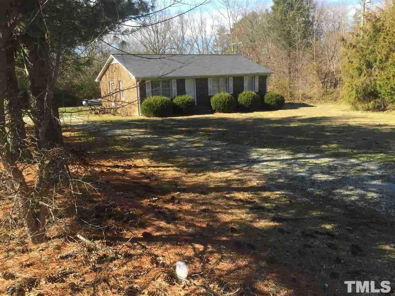 195 Morton-Pulliam Road Roxboro, NC 27574 - Photo 1 of 3 a front view of a house with a yard
