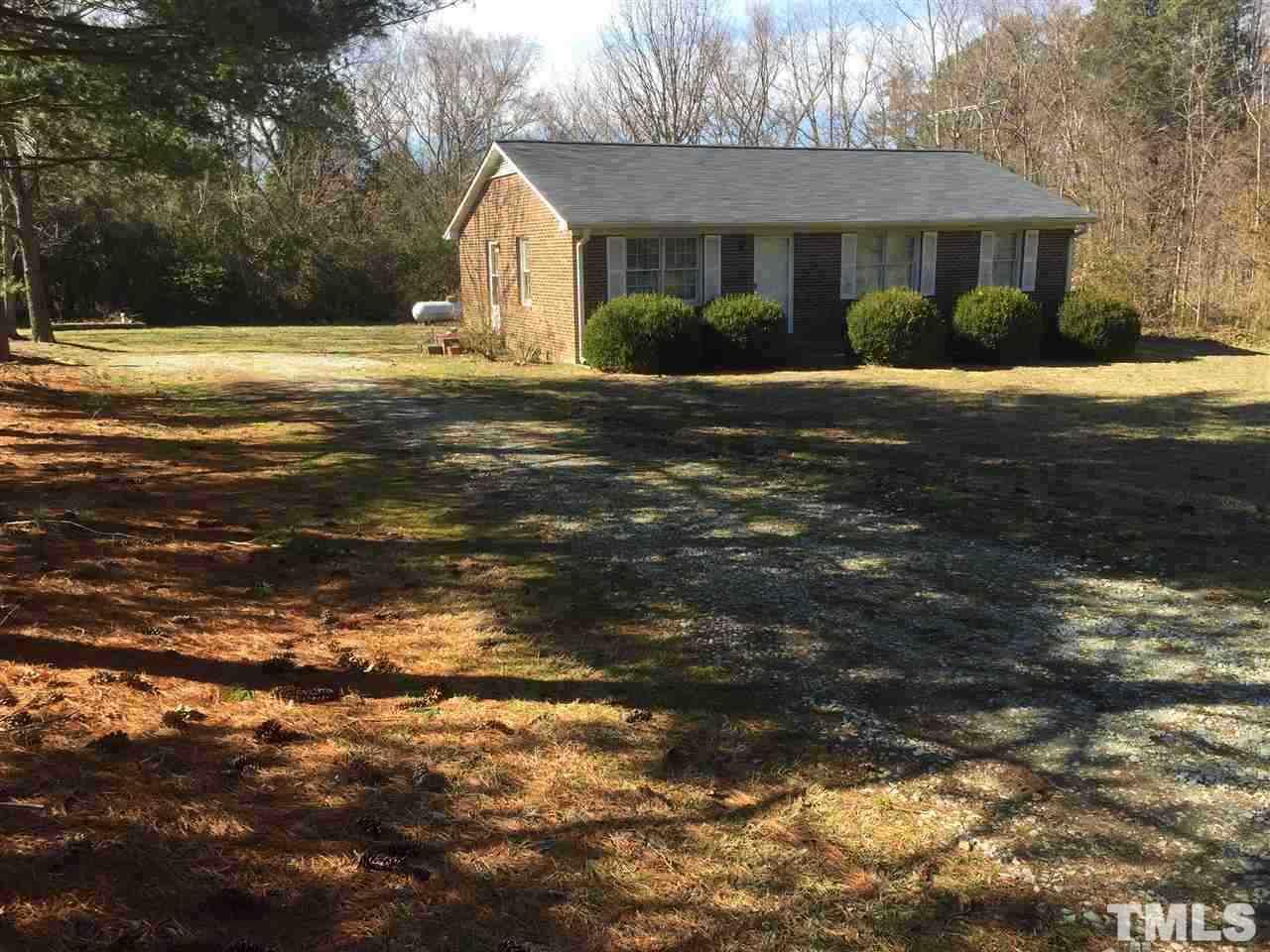 195 Morton-Pulliam Road Roxboro, NC 27574 - Photo 2 of 3 a front view of a house with a yard