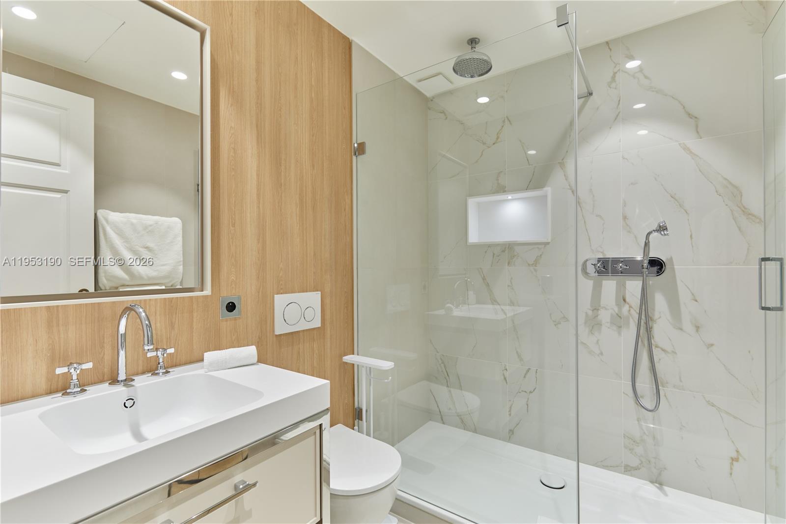 11 Rue Saint-Dominique, Unit SDO 403 Carrollton, IDF 75007 - Photo 11 of 40 a bathroom with a sink a toilet and shower