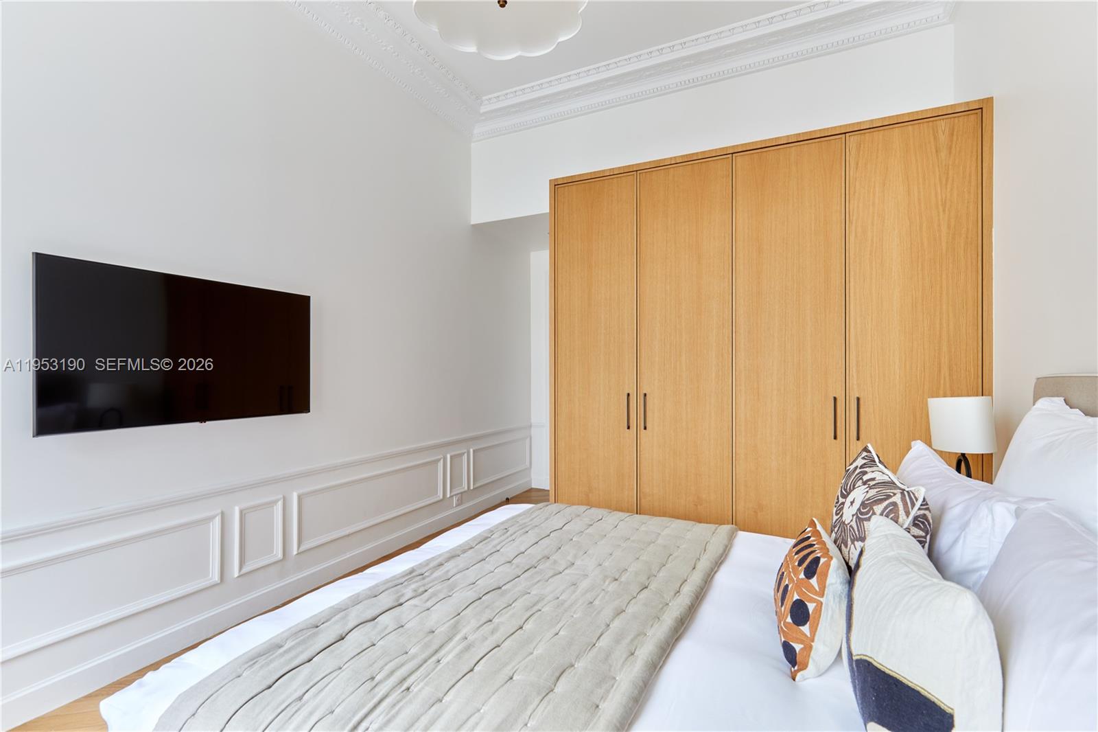 11 Rue Saint-Dominique, Unit SDO 403 Carrollton, IDF 75007 - Photo 16 of 40 a bedroom with a bed and flat screen tv