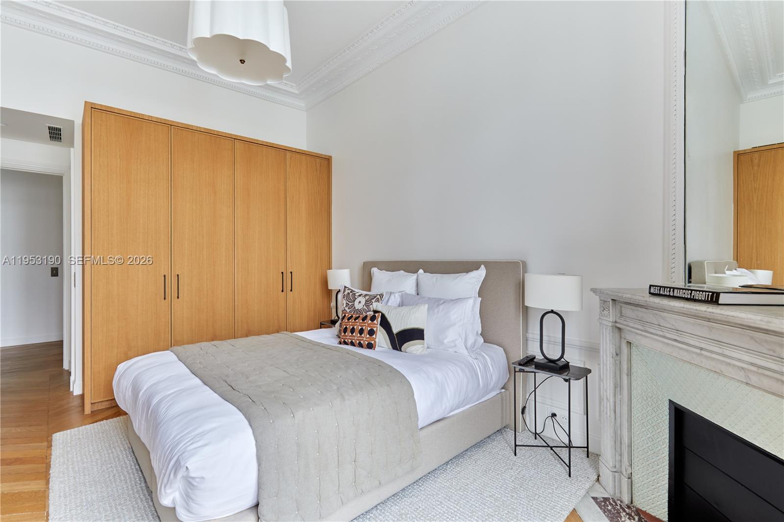 11 Rue Saint-Dominique, Unit SDO 403 Carrollton, IDF 75007 - Photo 17 of 40 a bedroom with a bed and a fireplace