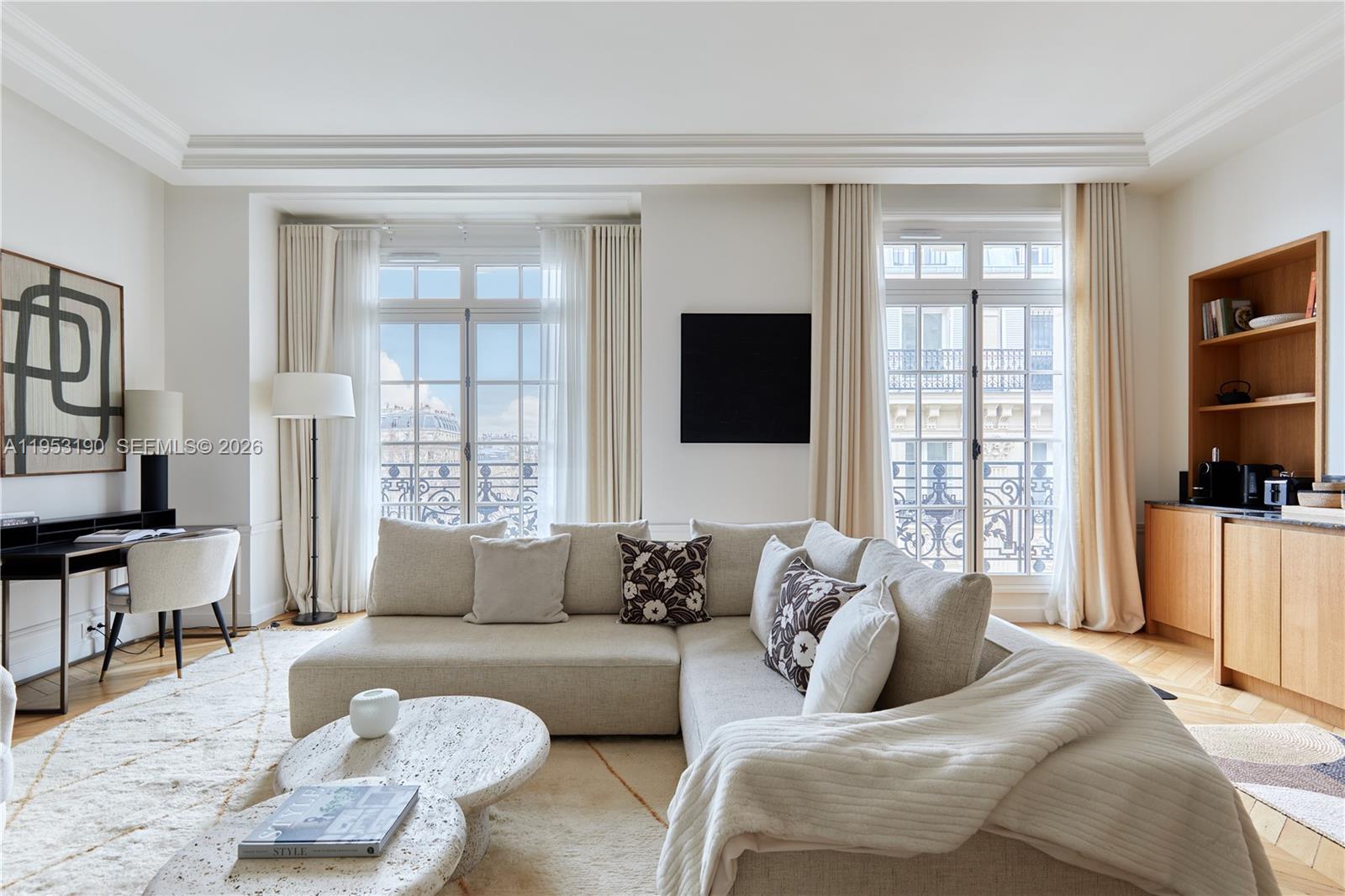 11 Rue Saint-Dominique, Unit SDO 403 Carrollton, IDF 75007 - Photo 2 of 40 a living room with furniture and a flat screen tv