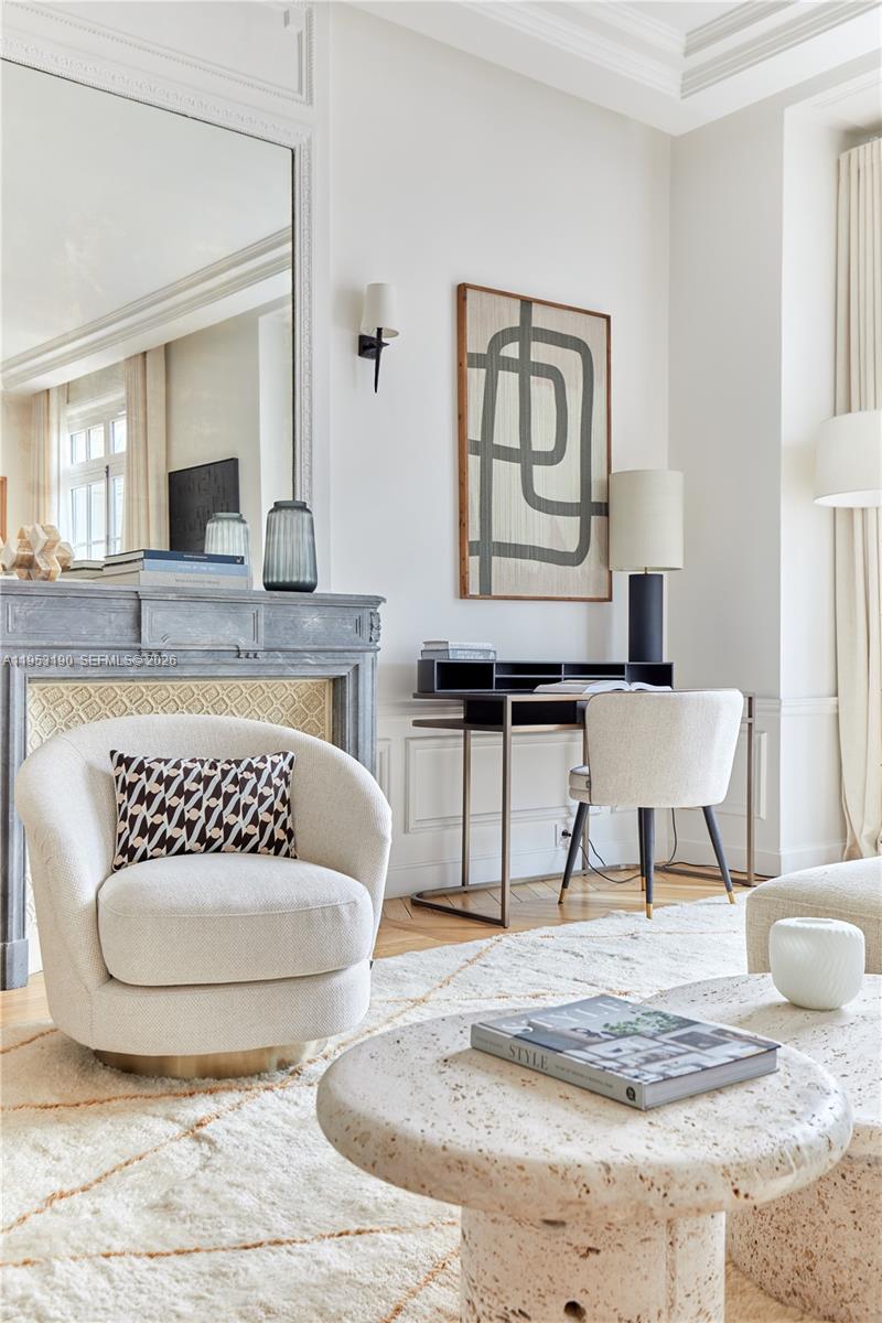 11 Rue Saint-Dominique, Unit SDO 403 Carrollton, IDF 75007 - Photo 21 of 40 a living room with a couch and a table