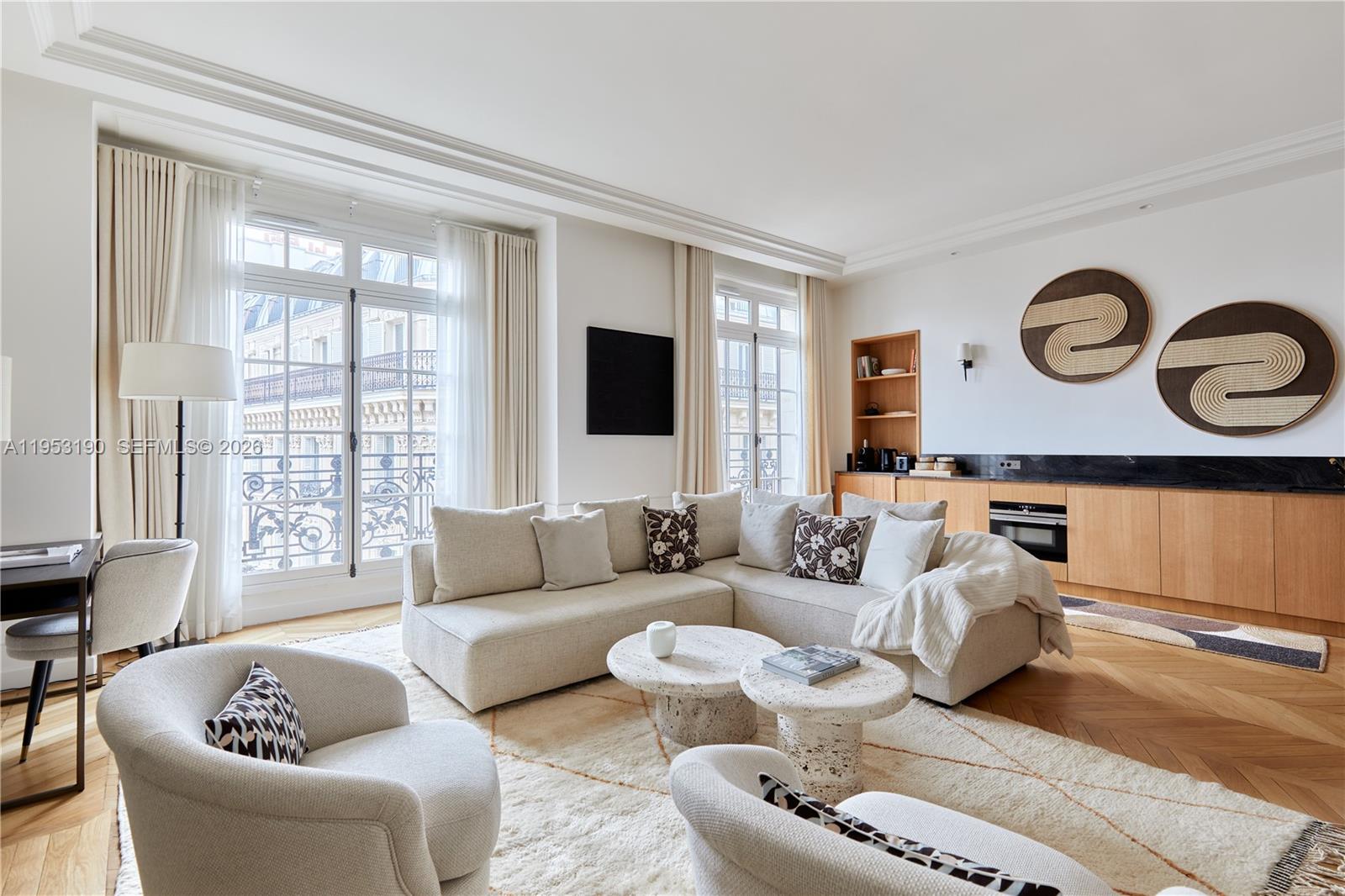 11 Rue Saint-Dominique, Unit SDO 403 Carrollton, IDF 75007 - Photo 23 of 40 a living room with furniture and a large window