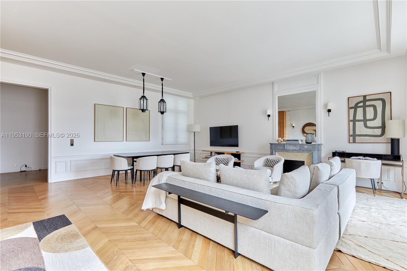 11 Rue Saint-Dominique, Unit SDO 403 Carrollton, IDF 75007 - Photo 26 of 40 a living room with furniture and a flat screen tv