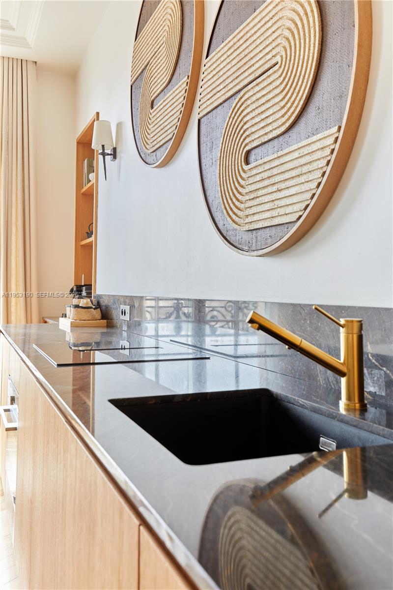 11 Rue Saint-Dominique, Unit SDO 403 Carrollton, IDF 75007 - Photo 27 of 40 a bathroom with a sink and a mirror