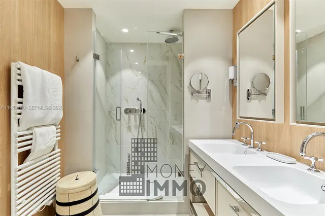a bathroom with a granite countertop sink a toilet and shower