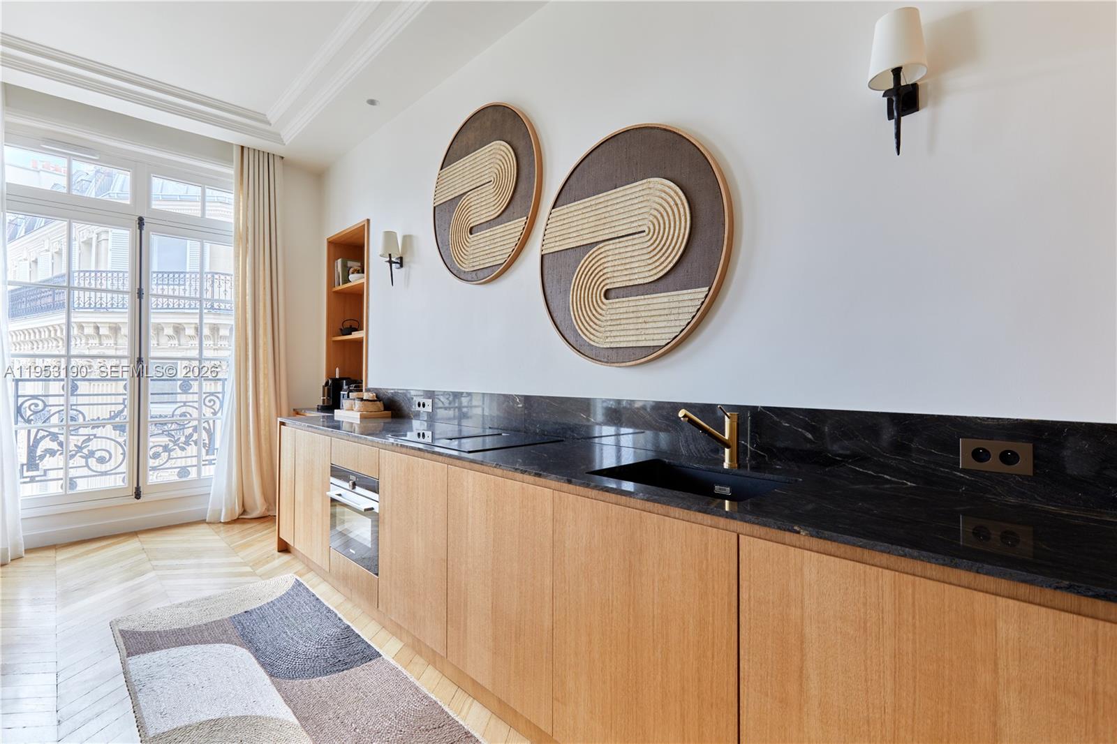 11 Rue Saint-Dominique, Unit SDO 403 Carrollton, IDF 75007 - Photo 28 of 40 a bathroom with a sink and a mirror