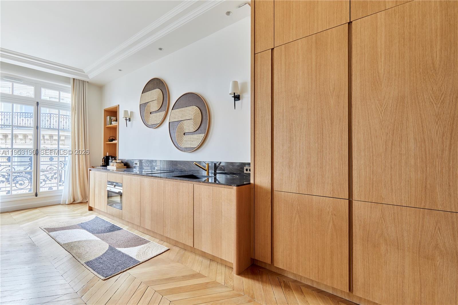 11 Rue Saint-Dominique, Unit SDO 403 Carrollton, IDF 75007 - Photo 29 of 40 a spacious bathroom with a large mirror and vanity