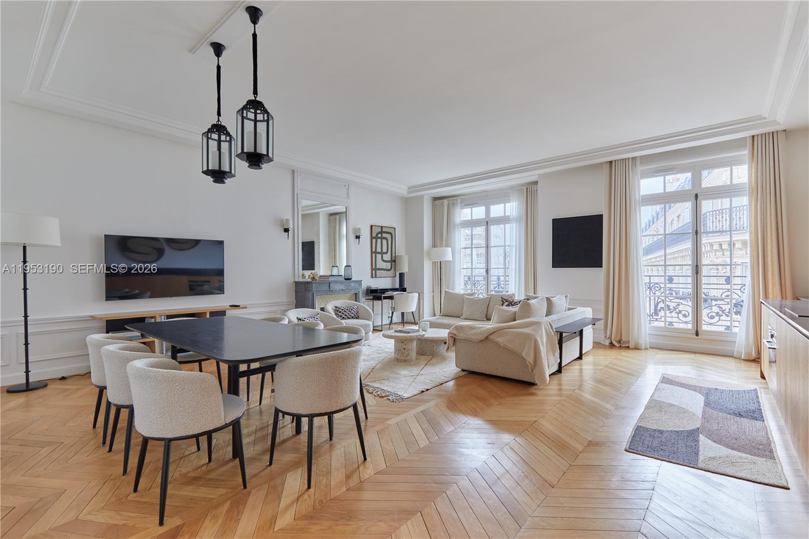 11 Rue Saint-Dominique, Unit SDO 403 Carrollton, IDF 75007 - Photo 30 of 40 a view of a dining room with furniture window and wooden floor