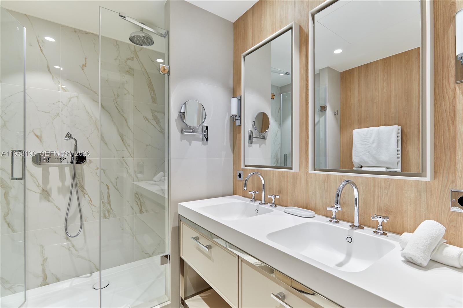 11 Rue Saint-Dominique, Unit SDO 403 Carrollton, IDF 75007 - Photo 32 of 40 a bathroom with a double vanity sink mirror and shower