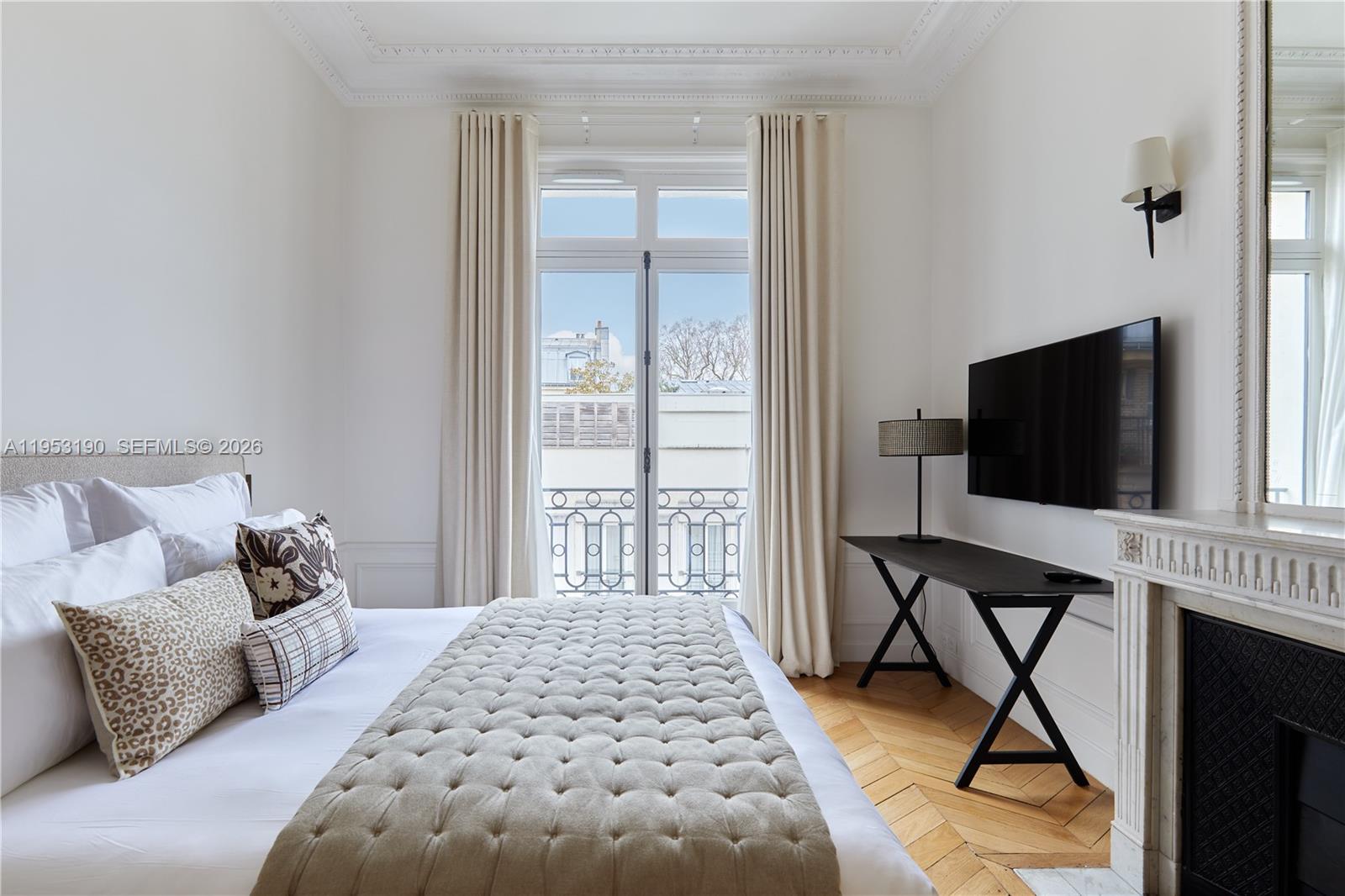 11 Rue Saint-Dominique, Unit SDO 403 Carrollton, IDF 75007 - Photo 8 of 40 a bedroom with a bed and glass floor