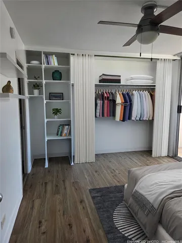 a bedroom with a bed and a walk in closet