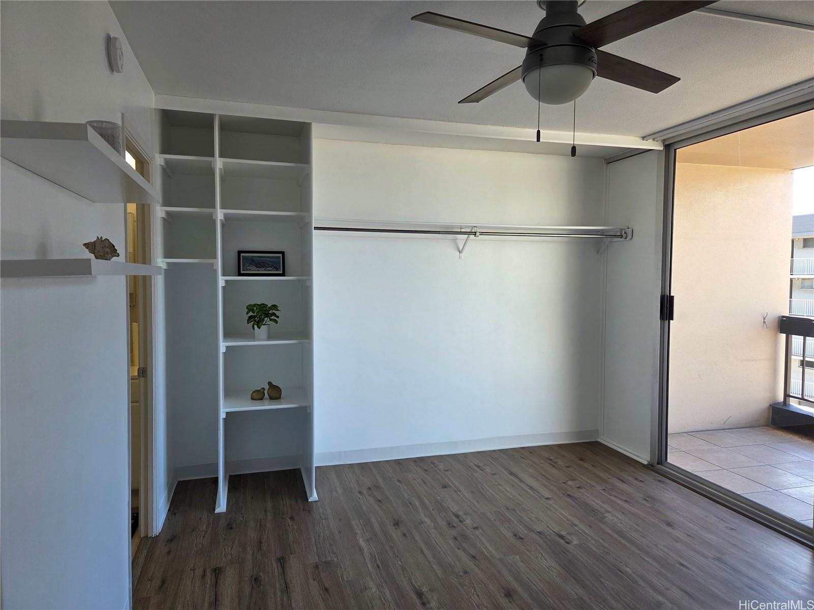775 Kinalau Place, Unit 1508 Honolulu, HI 96813 - Photo 12 of 23 a view of an empty room with a window and wooden floor