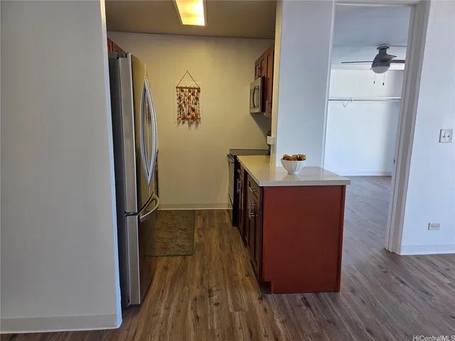 a room with wooden floor and a sink