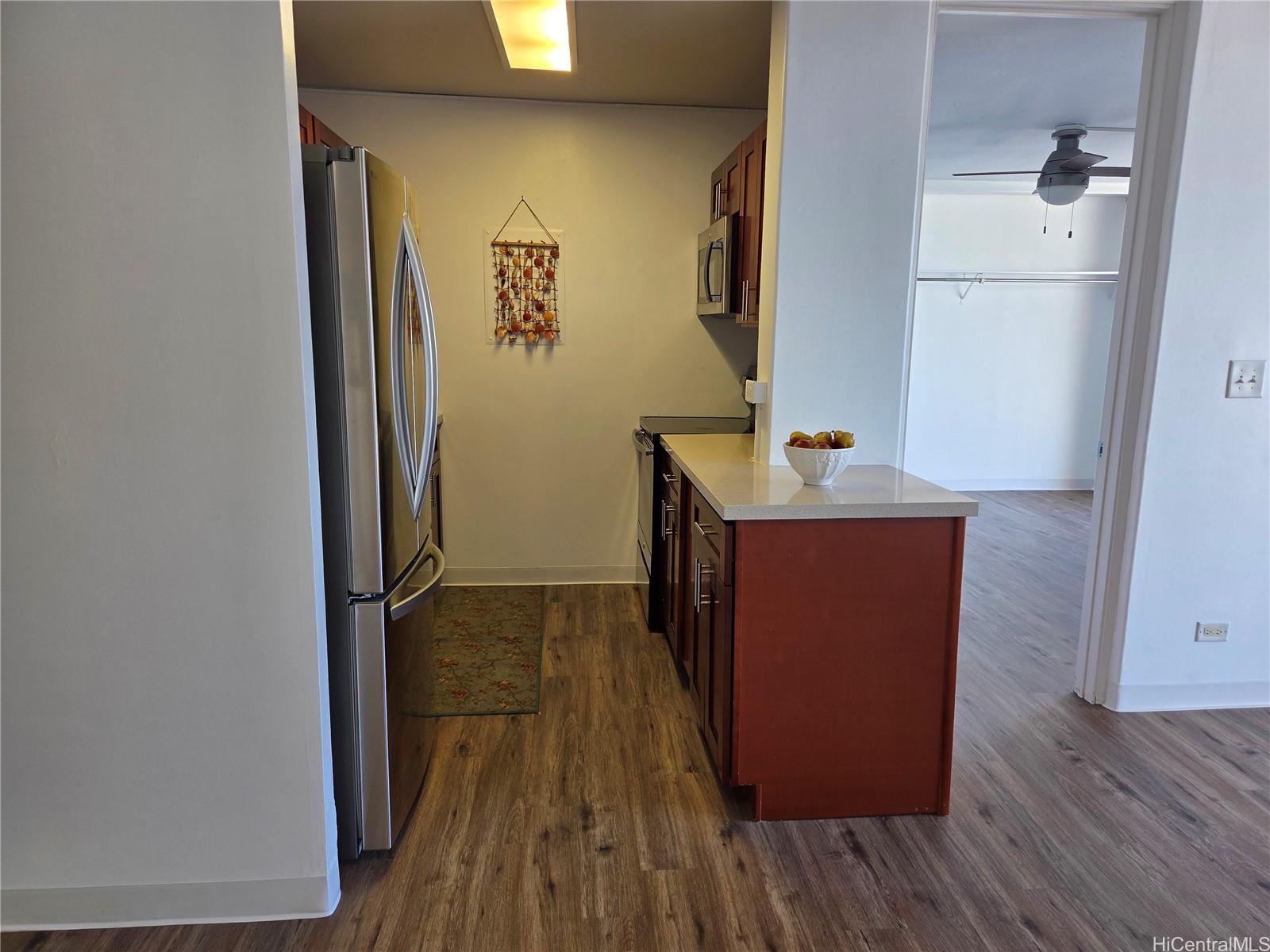 775 Kinalau Place, Unit 1508 Honolulu, HI 96813 - Photo 13 of 23 a room with wooden floor and a sink