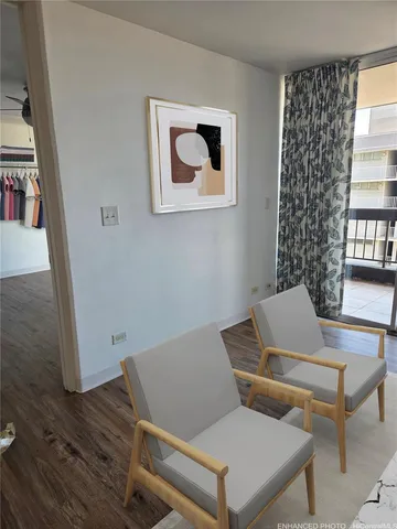 a laptop sitting on top of a wooden table