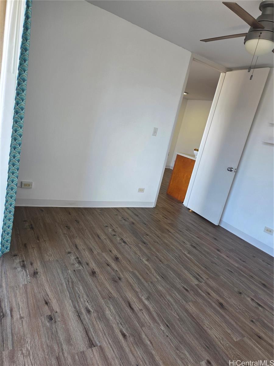 775 Kinalau Place, Unit 1508 Honolulu, HI 96813 - Photo 10 of 23 a view of an empty room with wooden floor