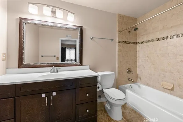 a bathroom with a toilet a sink and a bathtub