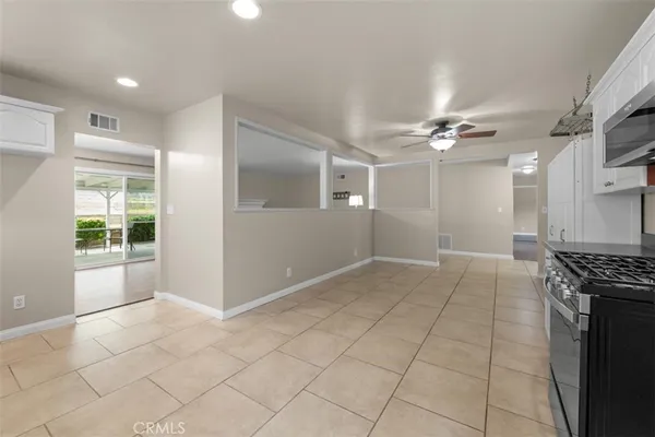 a view of kitchen with granite countertop cabinets and outdoor space