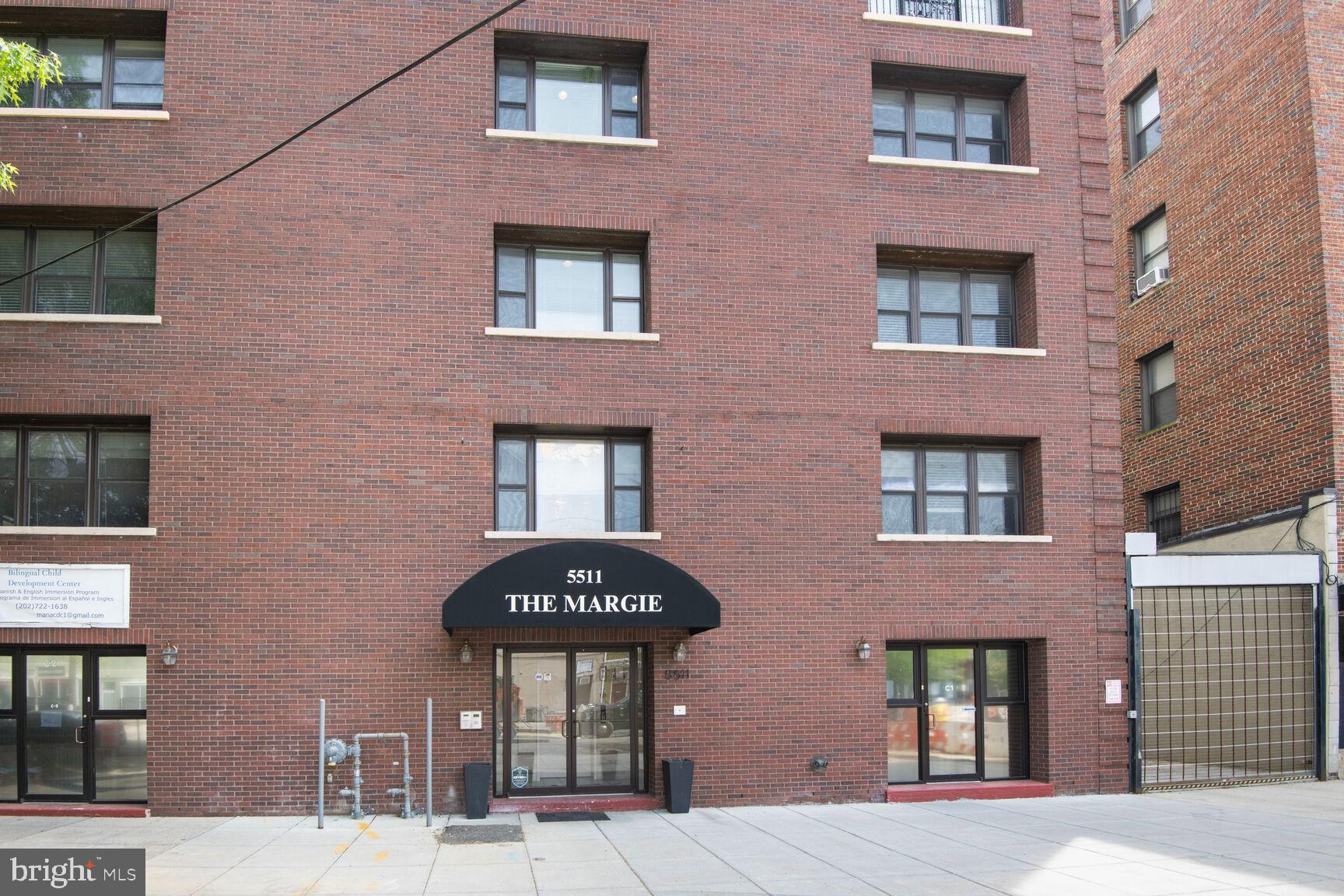 5511 Colorado Avenue Northwest, Unit 201 Washington, DC 20011 - Photo 15 of 15 a front view of a building with a glass windows