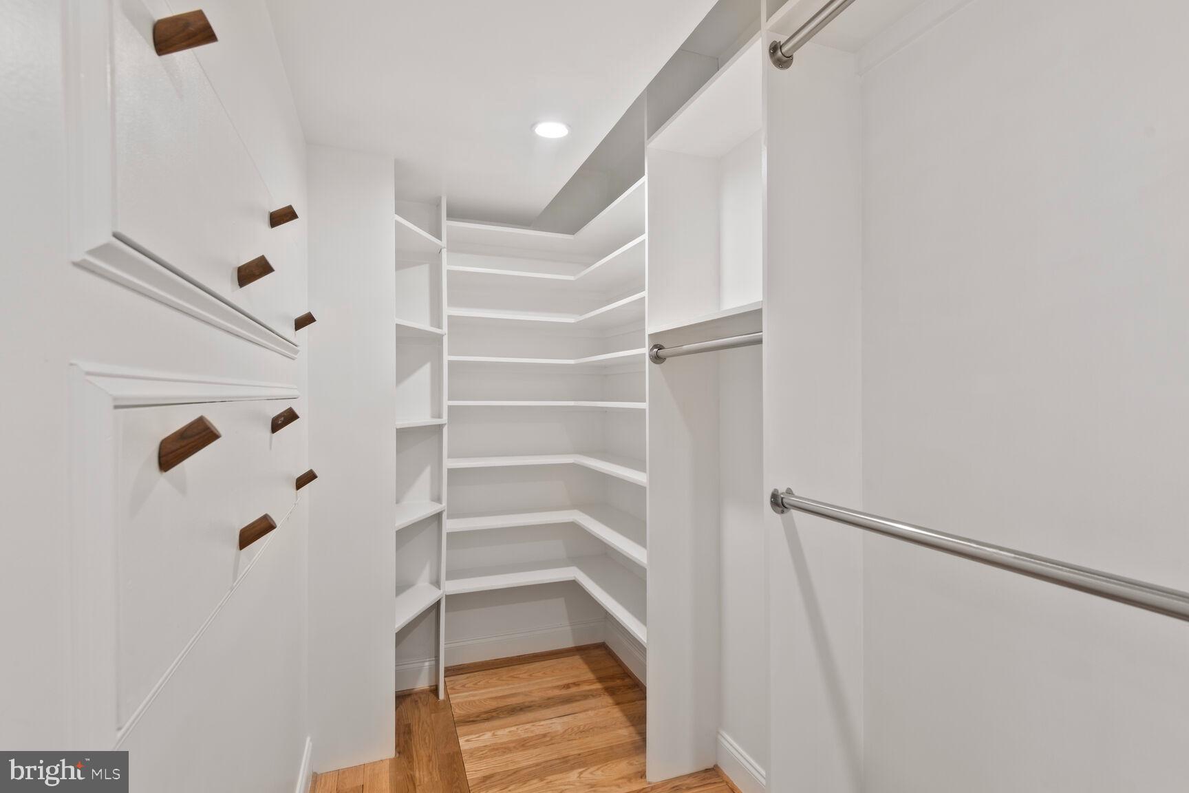 5511 Colorado Avenue Northwest, Unit 201 Washington, DC 20011 - Photo 8 of 15 a view of walk in closet with empty racks