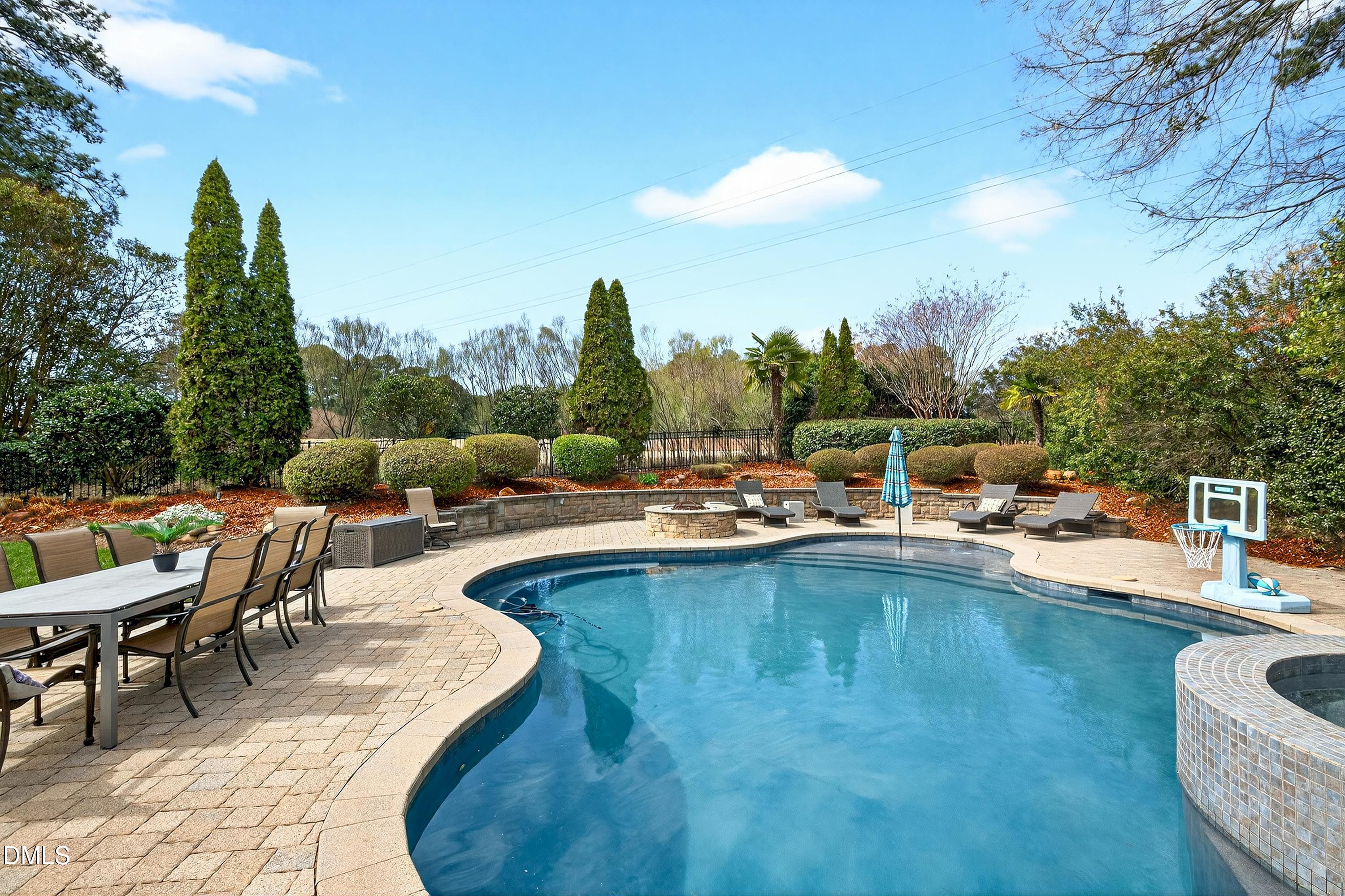 6701 Foxfire Place Raleigh, NC 27615 - Photo 13 of 67 a view of swimming pool with outdoor seating and plants