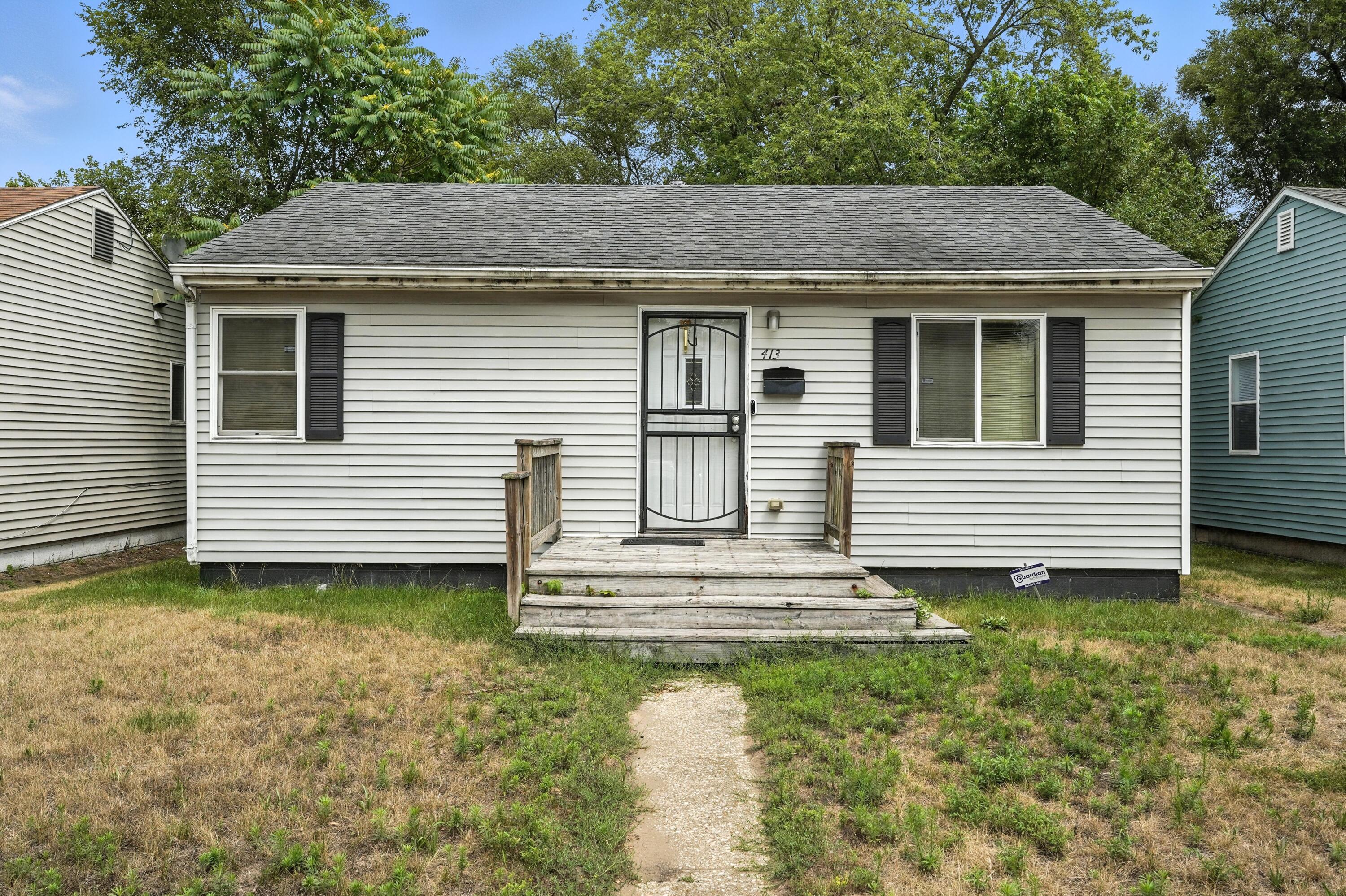 413 Dallas Street Gary, IN 46406 - Photo 1 of 2 a view of a house with a yard and stairs