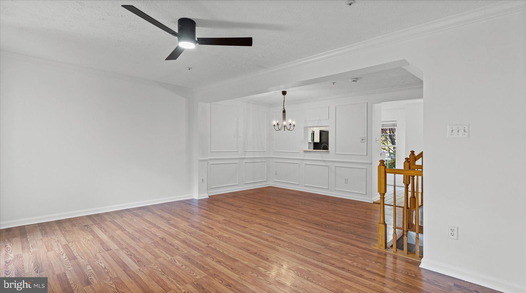 5108 Windermere Circle Baltimore, MD 21237 - Photo 13 of 38 a view of kitchen and empty room with wooden floor