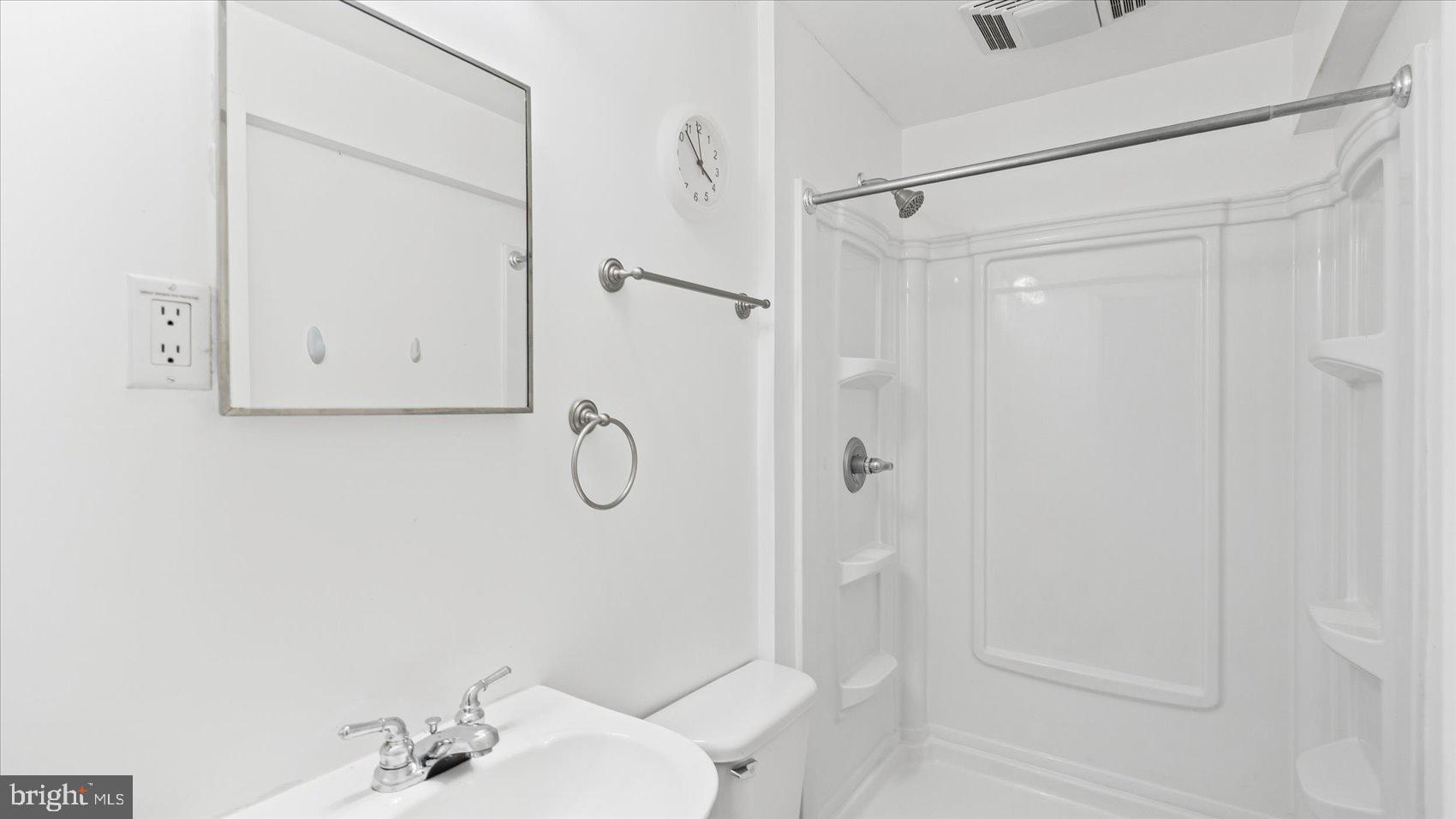 5108 Windermere Circle Baltimore, MD 21237 - Photo 29 of 38 a bathroom with a shower and a sink