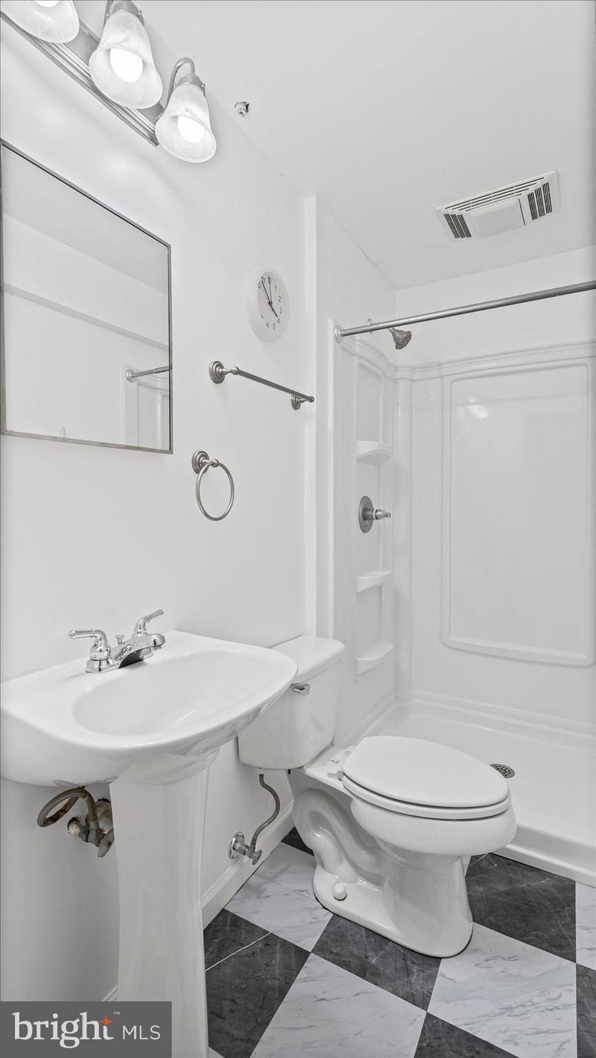 5108 Windermere Circle Baltimore, MD 21237 - Photo 30 of 38 a bathroom with a sink toilet and shower
