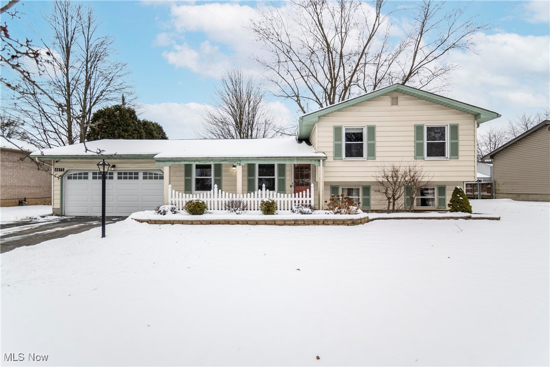 4875 New Road Youngstown, OH 44515 - Photo 1 of 25 Split level home with a garage and a porch